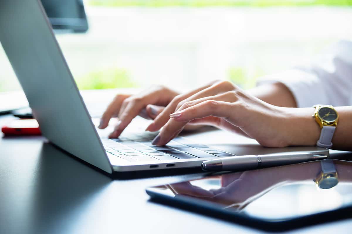 female, hand, typing, keyboard-Laptop, Buying a Laptop